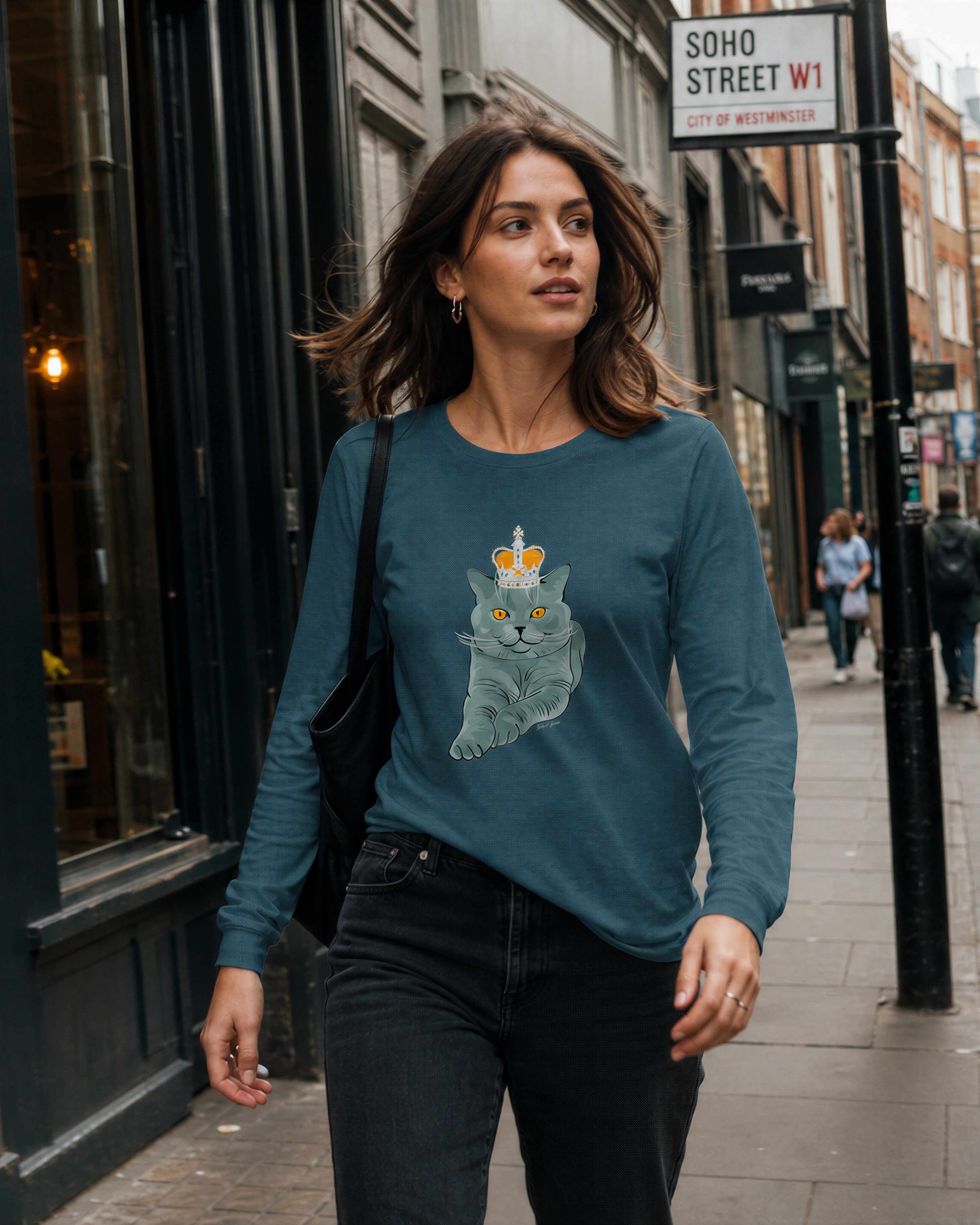 Clothing and gifts celebrating the British Blue Shorthair cat, with designs featuring a playful British Blue Shorthair sporting a golden crown and a Cheshire Grin. Cheers.